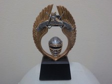 Hockey trophy award with engraving, about 4.5" tall, features hockey gear