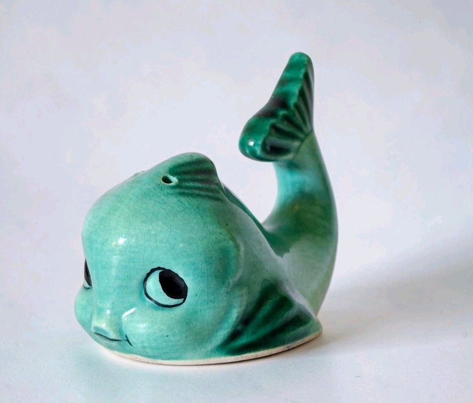 Turquoise ceramic fish-whale duo with goofy anthropomorphic faces — exactly the kind of mid-century Japanese kitsch that stops thrift-store hunters in their tracks.