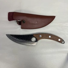 Huusk Japan knife, specifically one of their full-tang, high-carbon steel boning