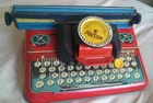 METTOY METTYPE JUNIOR TINPLATE TYPEWRITER. 1950S WITH ORIGINAL BOX.