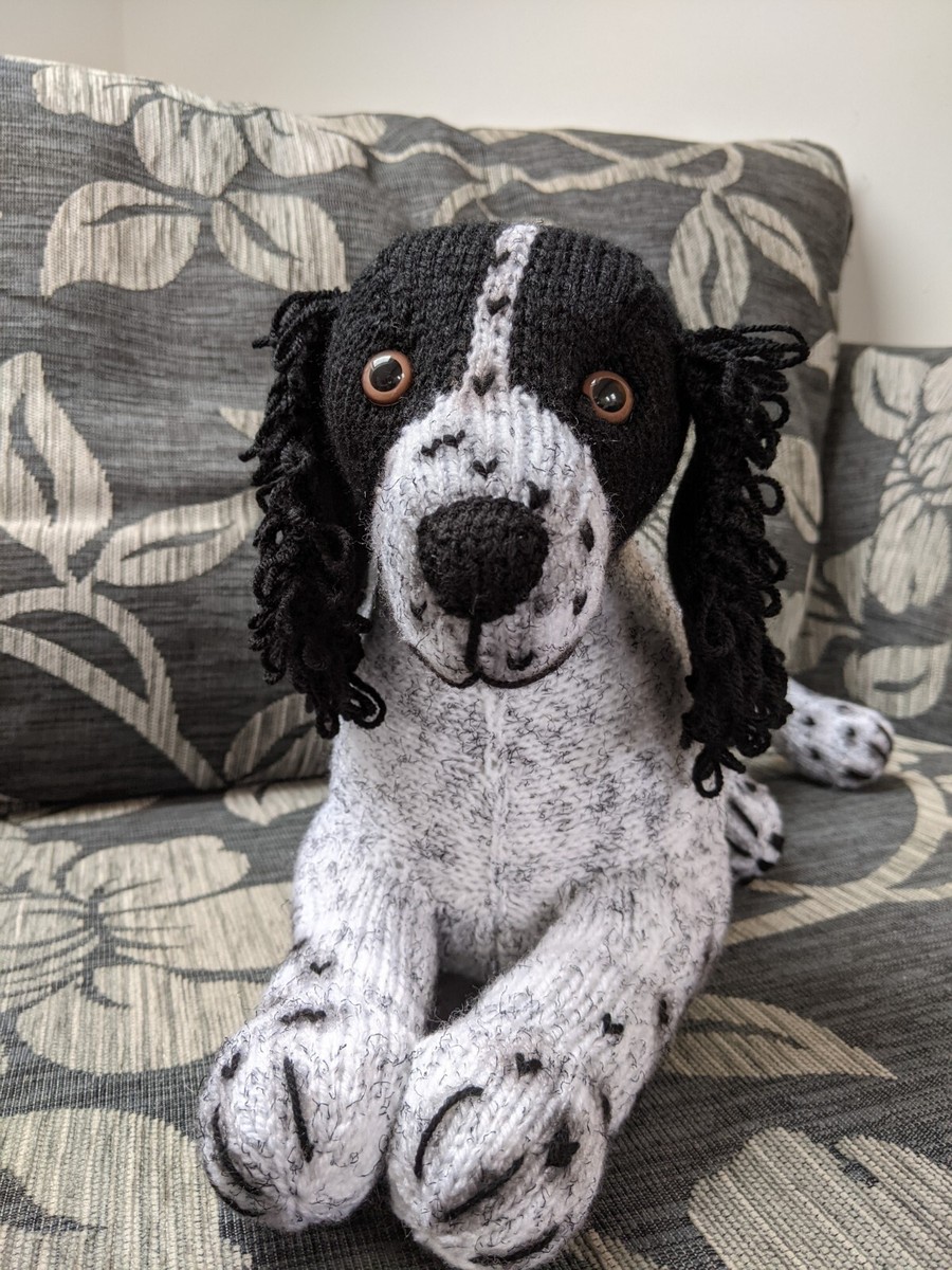 hand knitted black and white springer spaniel dog