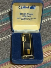 VINTAGE COLIBRI BUTANE LIGHTER BLACK AND GOLD TONE ORIGINAL BOX