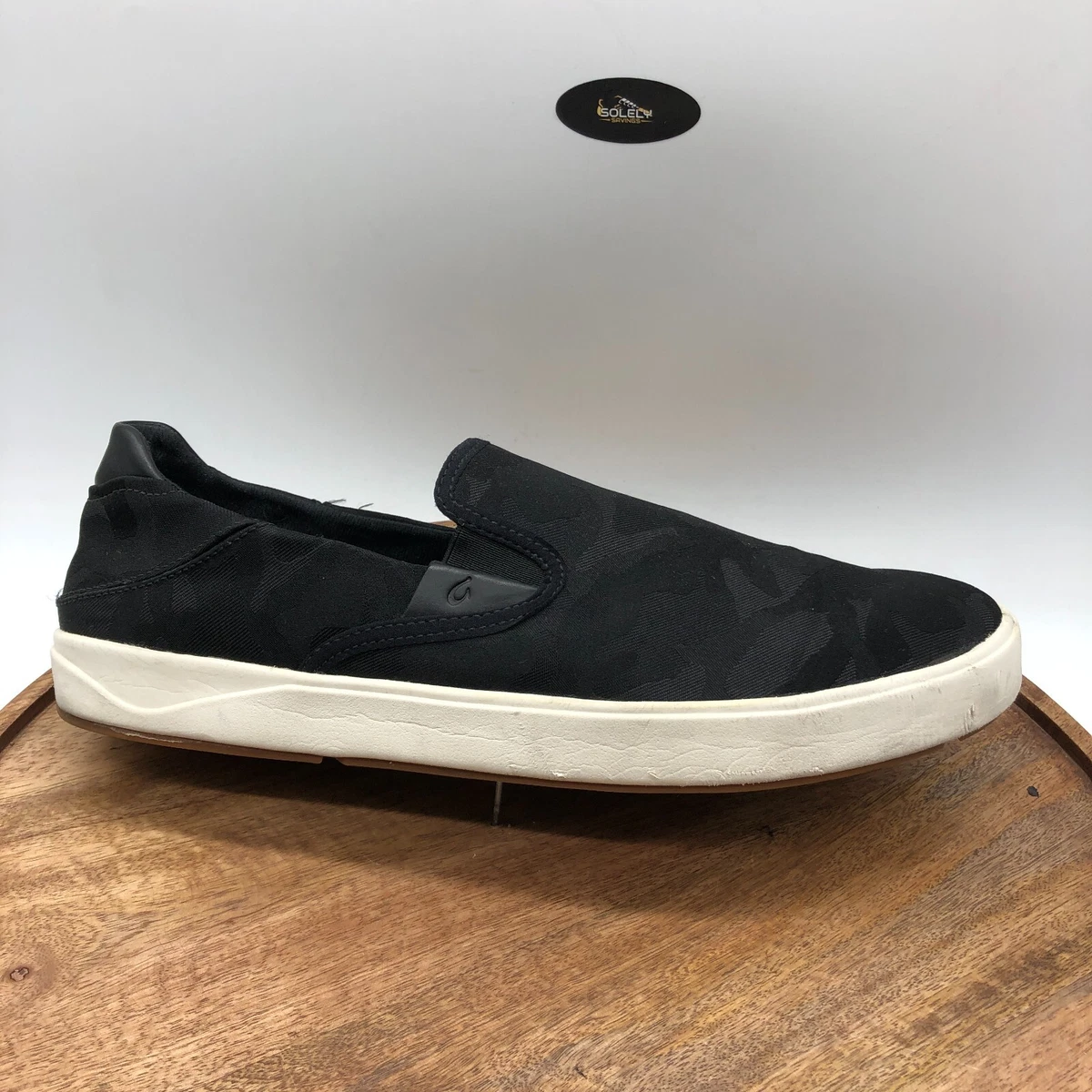 Olukai black hotsell shoes
