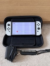 Nintendo Switch OLED 64GB Handheld Console with Carry Case, Charger And Grips