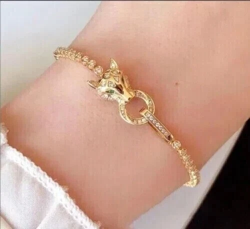 Brazalete tenis pantera redondo de diamantes simulados de 6 quilates de oro amarillo de 14 k Foto 2 de 4