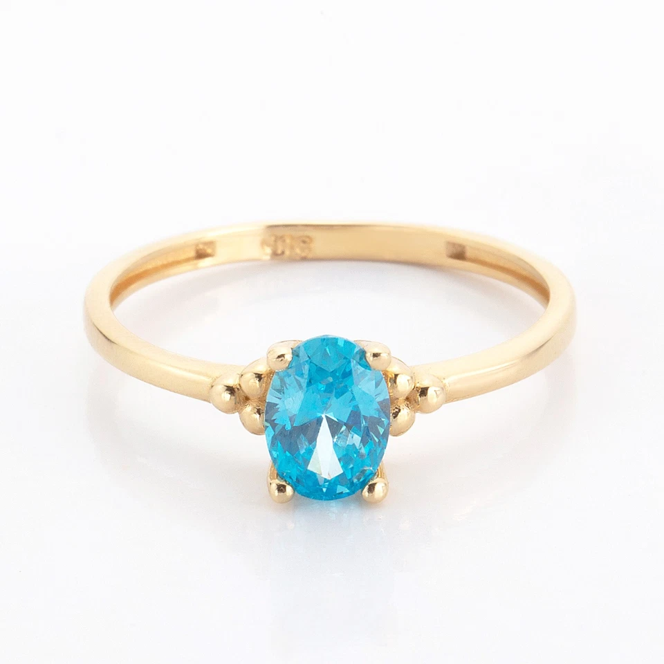 Anillo ovalado de oro amarillo de 14k con piedra aguamarina Foto 2 de 4