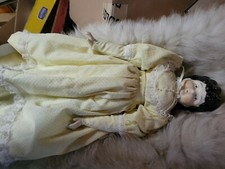 Vintage 17 inch china head, arms, and feet doll marked number 5 with cloth body