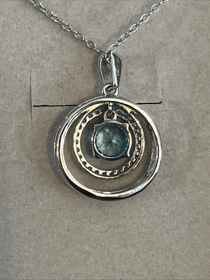 Colgante Zales de plata de ley con doble círculo de zafiro blanco y topacio azul Foto 4 de 4