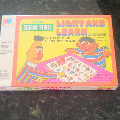 Milton Bradley Light and Learn Sesame Street Quiz Game SEALED.   AGES 4-7.