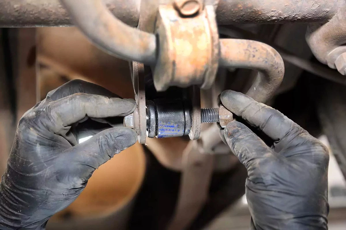 The lower shock bolt is installed into the axle mount.