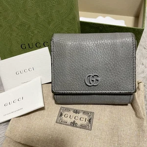 Portefeuille Gucci cuir gris double pli avec boite et accessoires comme
