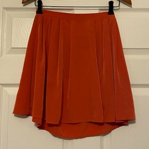 mini orange pleated skirt