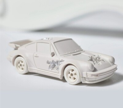 Hot Wheels x Daniel Arsham Eroded Porsche 930 and Rally Case