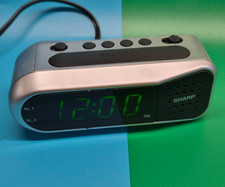 Sharp Digital Small Alarm Clock LED Display Battery Backup Snooze Model SPC100