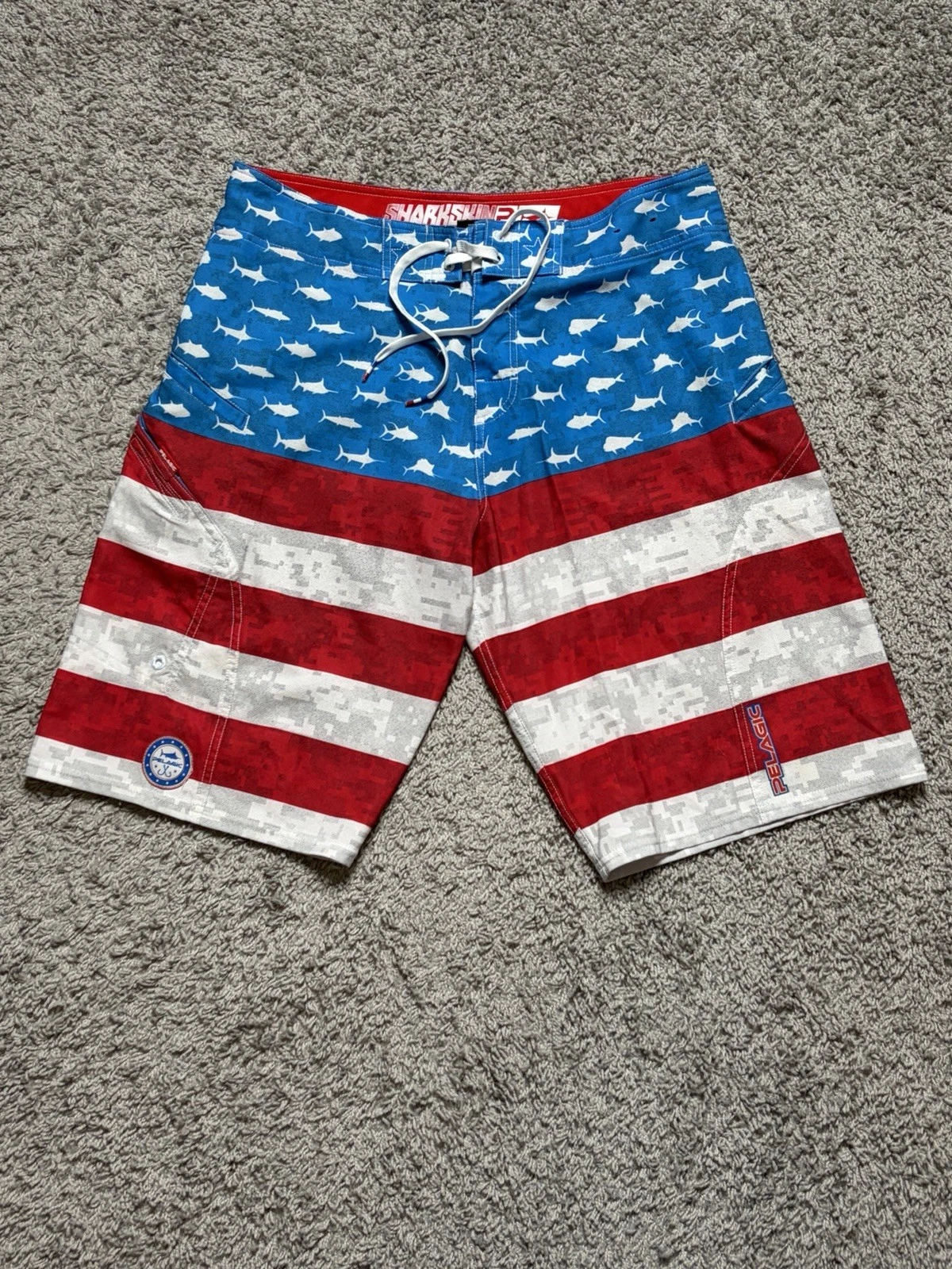 Pelagic Sharkskin Board Shorts Mens Size 32 American Flag Swim Beach Trunks