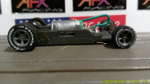 AFX RACING H.O. SCALE MEGA G+ 1.7 NARROW CHASSIS WITH GRAY 5 SPOKE RIMS LET TIRE