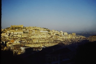 RED BORDER SLIDE Lisbon hillside city with castle overlooking the river.