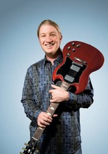 Portrait of guitarist Derek Trucks posing with his Gibson SG guita- Old Photo