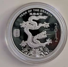 APMEX 1 OUNCE SILVER ROUND 2012 YEAR OF THE DRAGON SILVER COIN IN CAPSULE