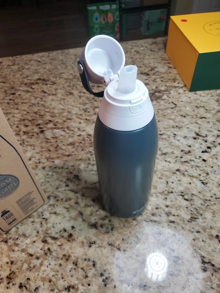 Botella de agua filtrante premium filtro de vacío aislado Brita de acero inoxidable Foto 3 de 4