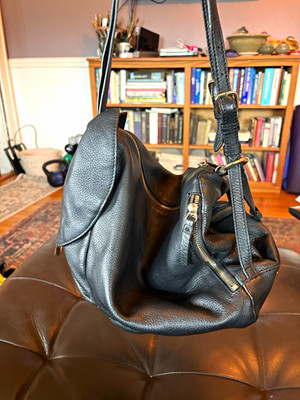 Vince Camuto Black leather gold hardware crescent bag convertible backpack.
