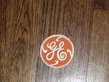 general electric (ge),orange  backround/  white  letter, 2.75"x2.75",nos, 1960's