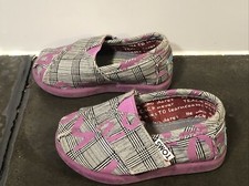 Toddler girl's Toms slip on shoes size 3, black/white/pink