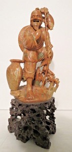 Very Intricate Hand Carved Chinese Peach Soapstone Fisherman Figure on Dark Base