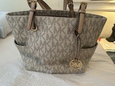 borse michael kors con iniziali MK. Marrone e bianco.