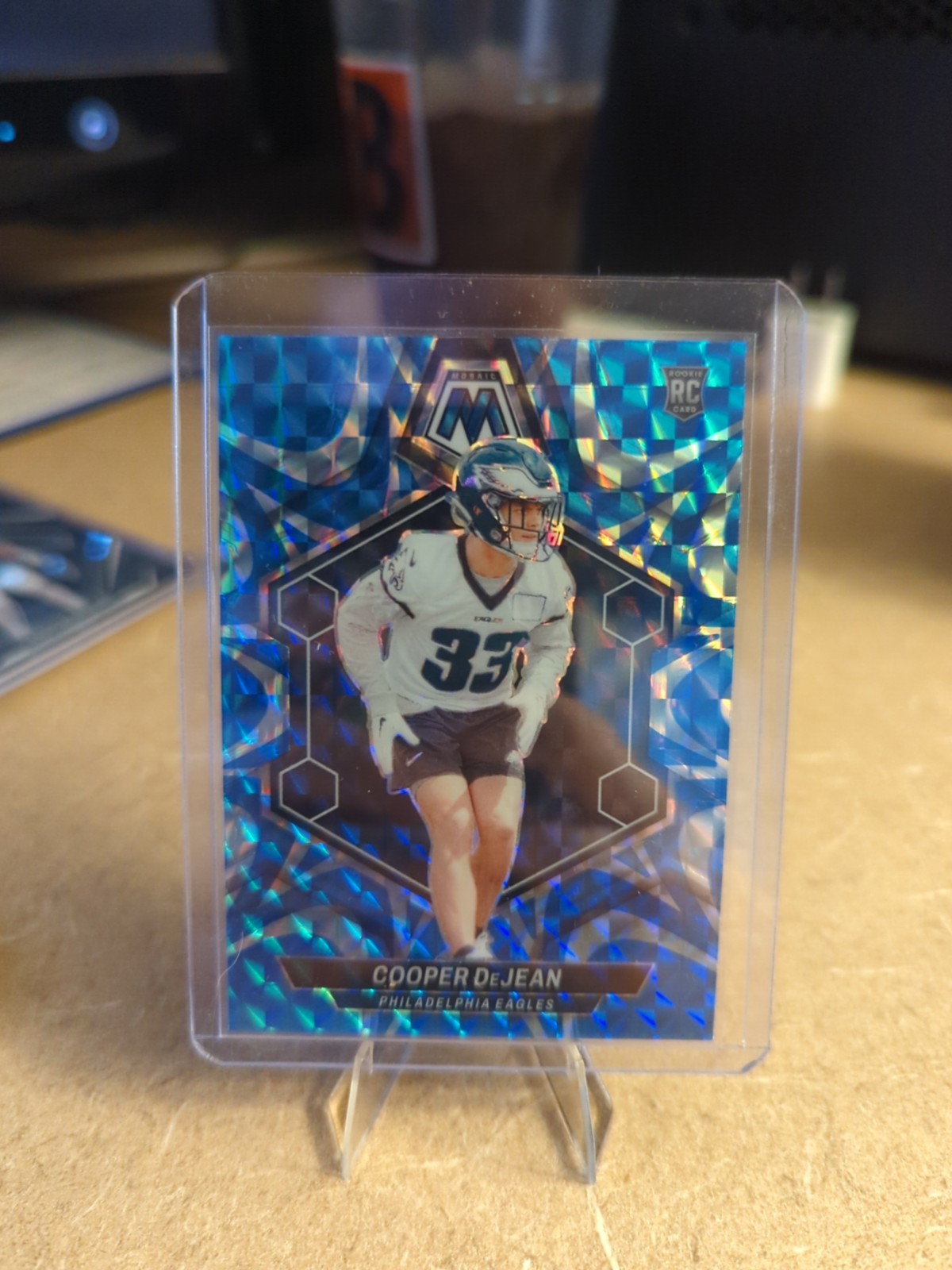 2024 Panini Mosaic - Rookies Cooper DeJean #340 Reactive Blue Mosaic Prizm (RC)