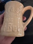 Beige ceramic mug with embossed text “Old Fashioned Root Beer” and “Tepco” in bold block letters on the side.
