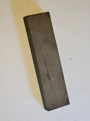 A old sharpening stone used condition