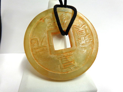 Vintage jade disc rd hd carved on blk cord necklace sz 18in lg wgt27.2 tancolors