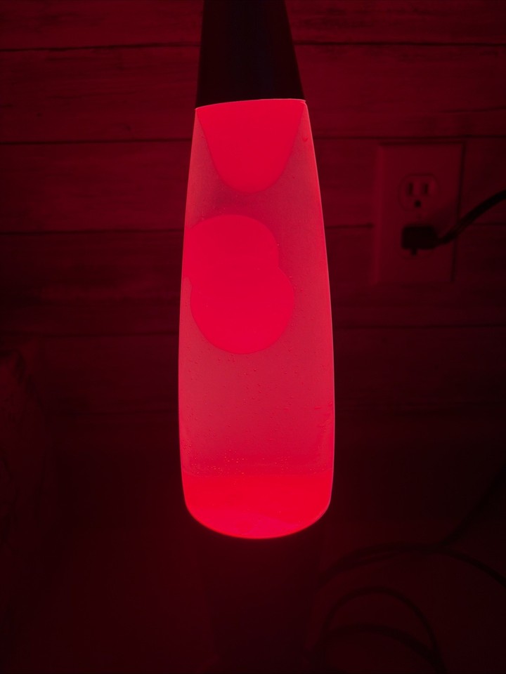 A verified-working vintage 16" Bullet Lava Lamp — the iconic LP-20 shape with red lava and silver hardware, a genuine piece of retro Americana.