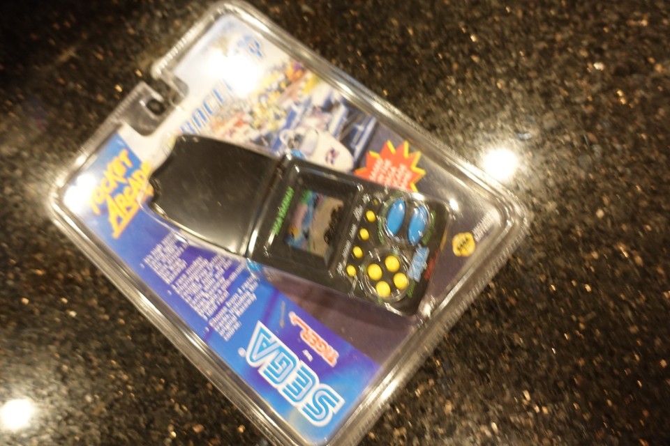 A rare, new-in-package Sega Raceway Tiger handheld — still sealed, combining two iconic 80s/90s brands in one collectible package.