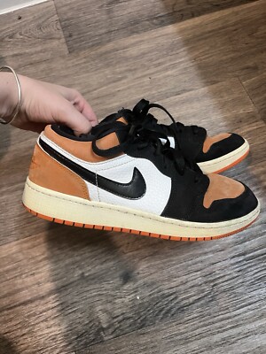 Orange And Black Nike Retros Low Tops. 