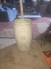 An antique Red Wing Union Stoneware Company 3 gallon butter churn with lid.