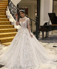 Luxurious Ivory Lace A-Line Wedding Dresses With Illusion Long Sleeves High Neck