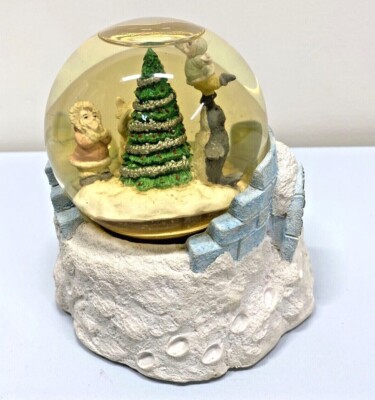 Peace on Earth musical snow globe plays Here Comes Santa Claus, eskimo seal fox