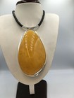 Unique necklace with huge white amber