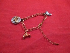 Wonder Woman Shield Bracelet w/ Charms "What I Do Freely, I Do Freely"