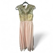 New with Tags formal dress size 3/4. Sheer top embroider cap sleeves