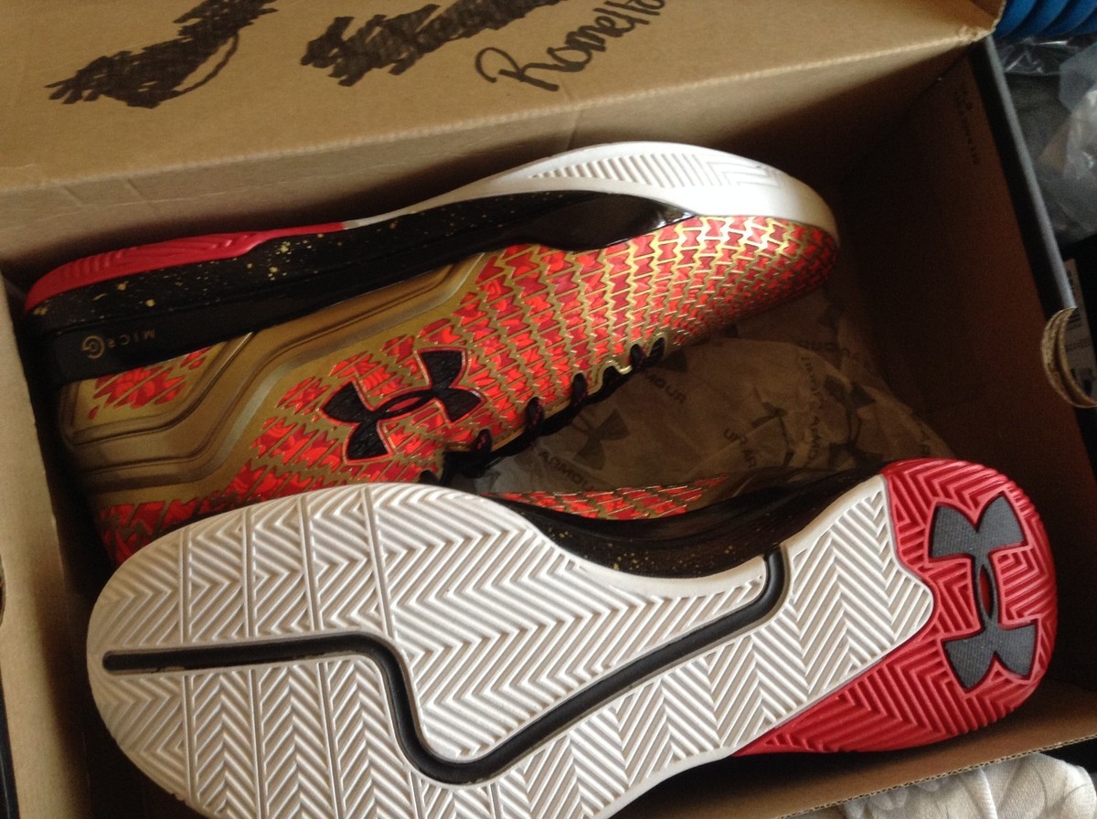 Under Armour Clutchfit Drive low Gold Black Red Emmanuel Mudiay