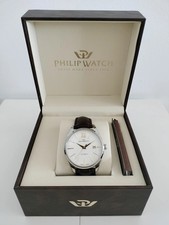 Reloj automático de esfera blanca con correa de cuero marrón