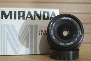 Super fast Miranda 24mm f2.8 prime FD fit lens in its original box. A rare find.