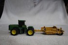 1/64 JOHN DEERE 9300 TRIPLES W/JOHN DEERE PAN SCRAPER — photo 1