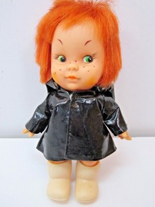 old doll with red hair