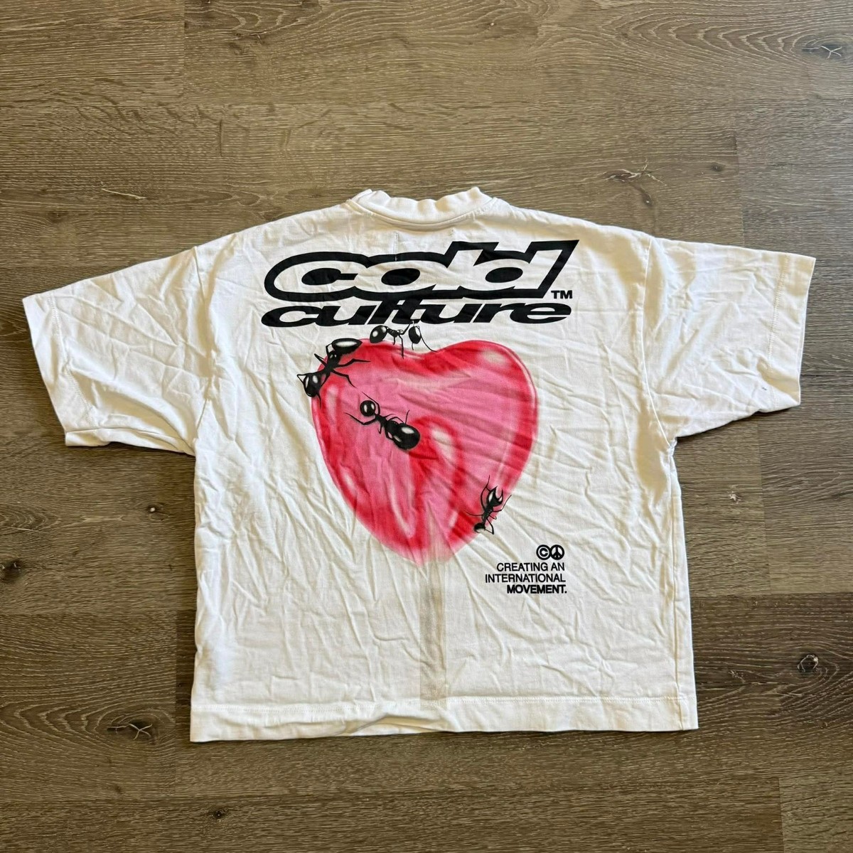 Cold Culture lollipop t-shirt featuring a heart graphic with ants