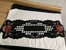 Vtg. black felt table runner w/stitched floral designs and cutout areas.