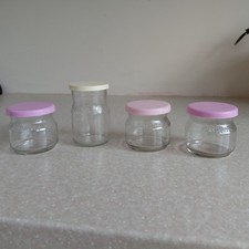 Four vintage St Michael/Sainsburys glass jars with caps 1980s